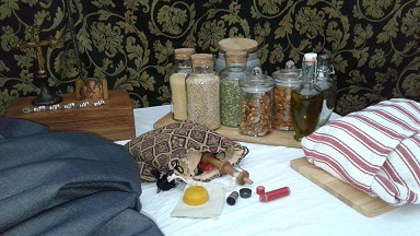 Sewing at the table in my tent during Canterbury Faire, 2019